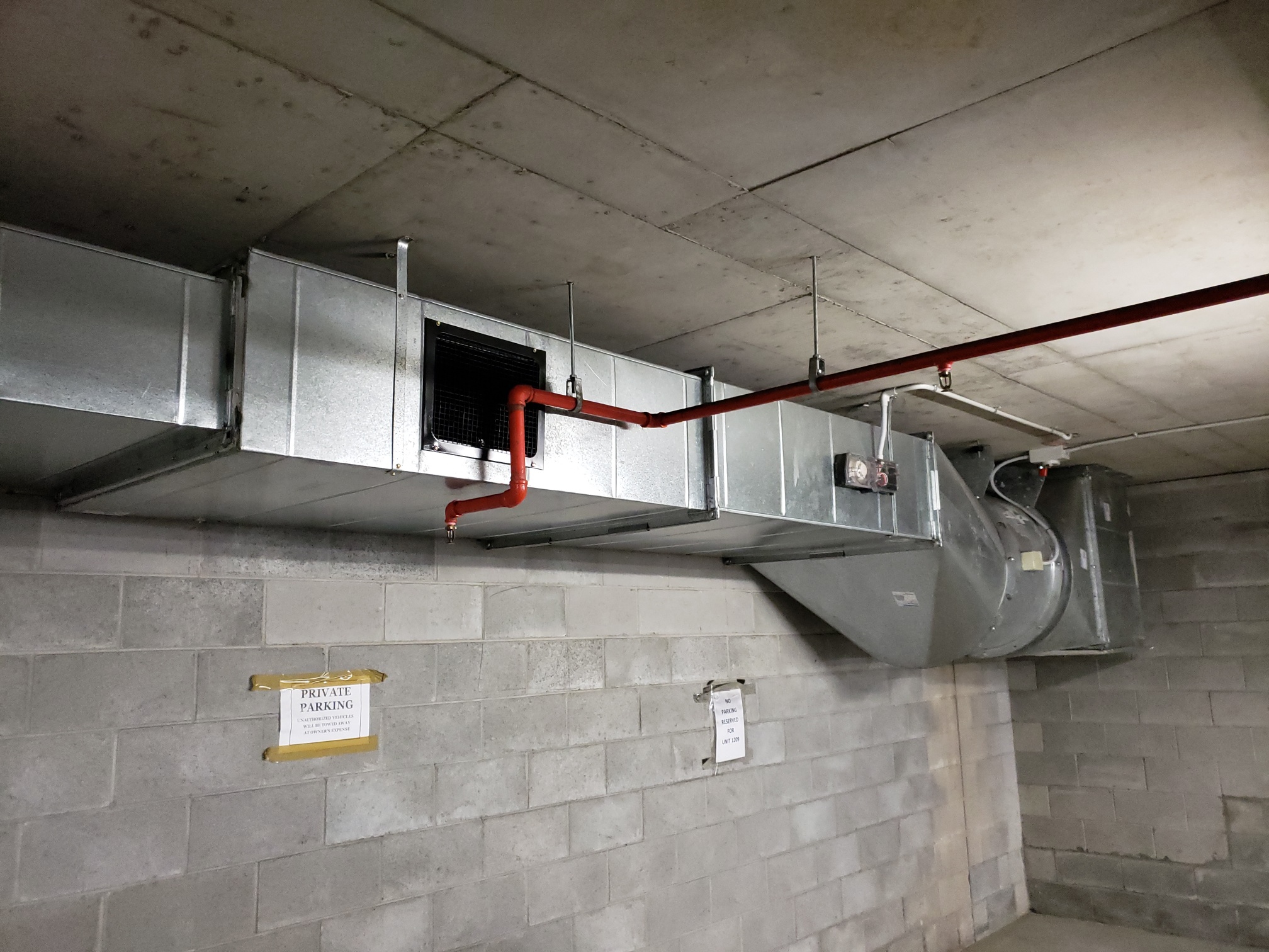 mechanical ventilation system ductwork installed for a carpark with fire sprinkler